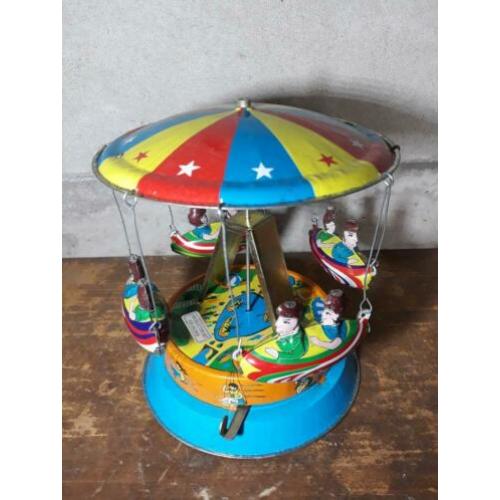 oude vintage blikken speelgoed draaimolen merry go round