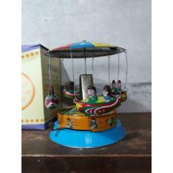 oude vintage blikken speelgoed draaimolen merry go round