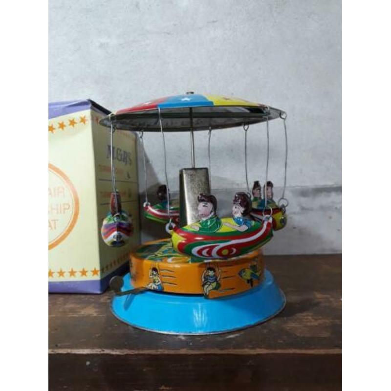 oude vintage blikken speelgoed draaimolen merry go round