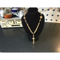 Goudkleurige ketting zie foto’s
